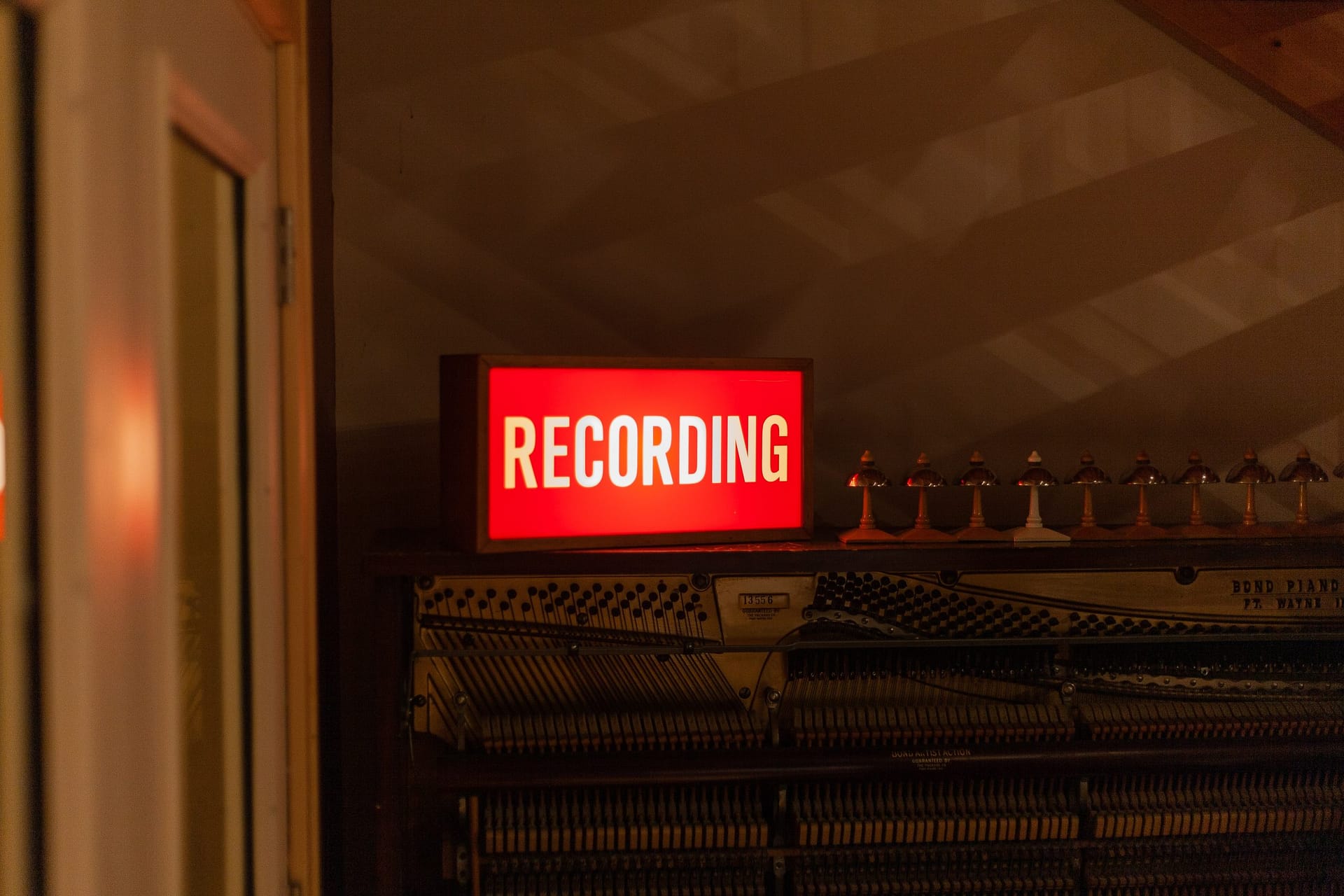 Red illuminated recording sign